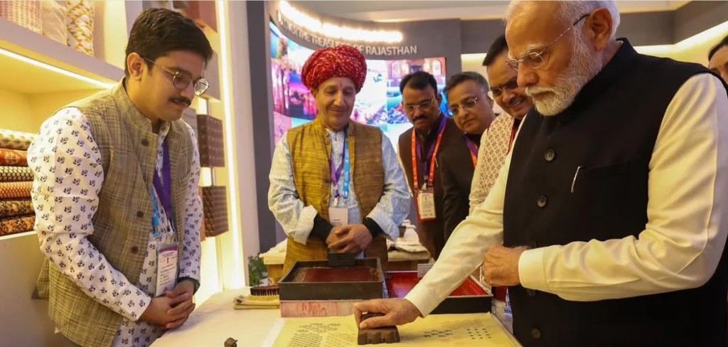 Awdhesh Kumar demonstrating hand block printing at Rising Rajasthan